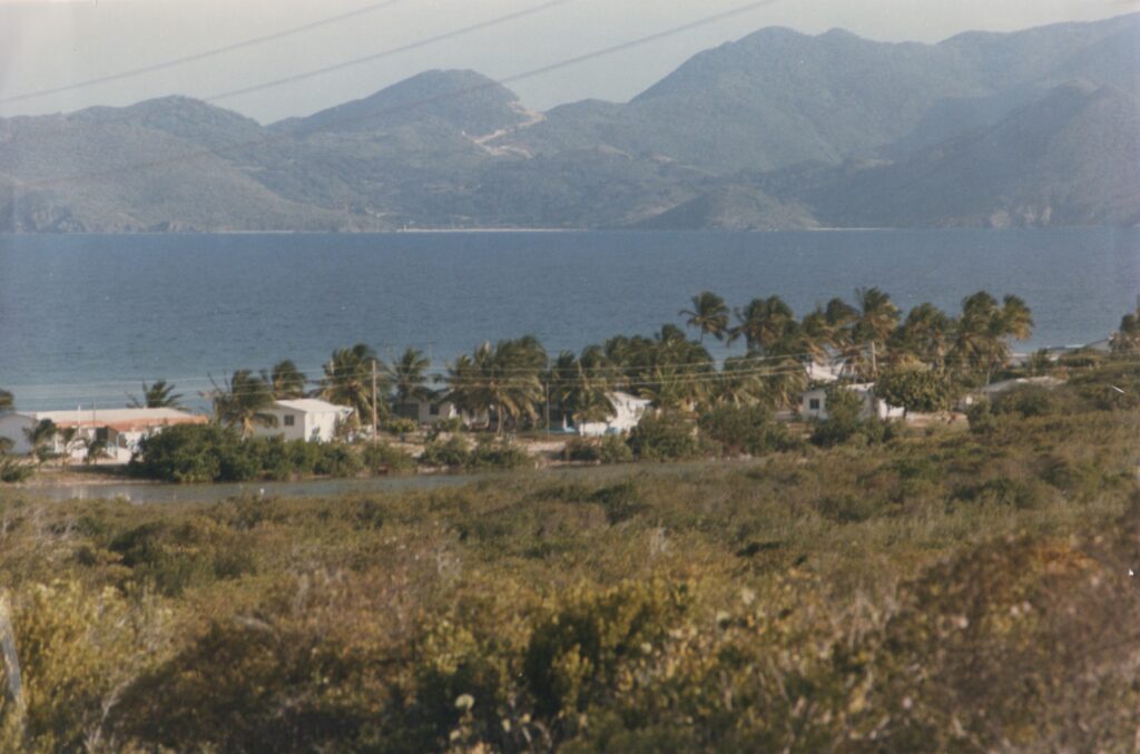 The Summer the World Came Calling Corito Beach Cottages, Anguilla, 1984. St. Martin in the distance. Photo by Gary Rodrigues. Copyright 1984-2026.
